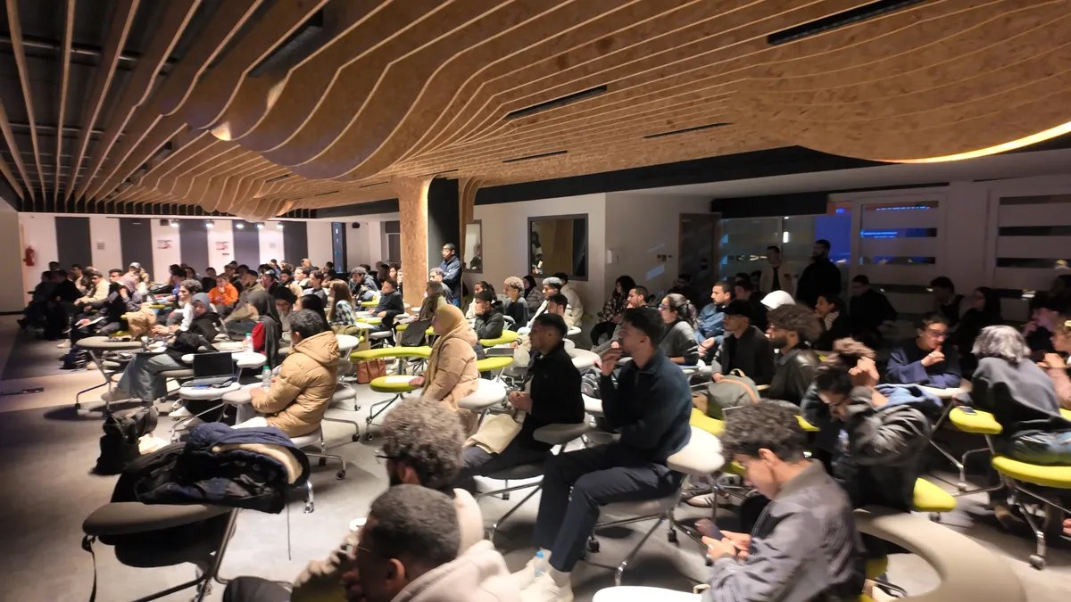 teams at 1337 school working and presenting their healthcare projects